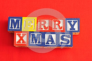 Merry Xmas spelled with Alphabet blocks