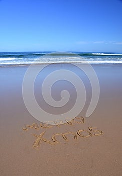 Merry Xmas written on sand