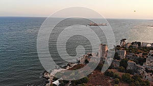 Mersin coastline Kizkalesi with historical Kiz kalesi castle on island background . Travel landmark and destination