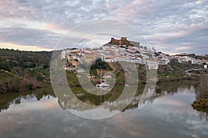 Mertola city view at sunset with Guadiana river in Alentejo, Portugal