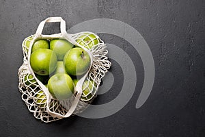 Mesh bag with fresh green apples