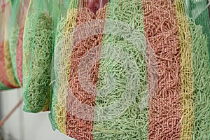 Mesh bags of Miki noodles hanging at a Ilocano restaurant