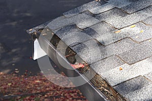 Mesh on home rain gutters keeping leaves out