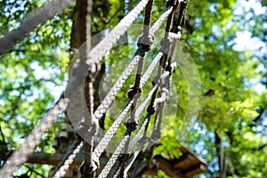 Mesh obstacle detail in green forest adventure playground