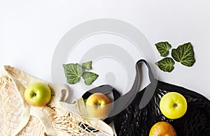 Mesh Shopping Bag With Green Apples on white background. Zero waste shopping concept.