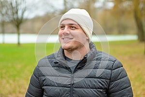 Mesmerised young man looking up with a smile