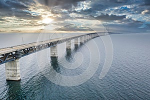 Mesmerizing aerial view of the bridge between Denmark and Sweden under the cloudy sky