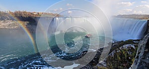 Mesmerizing panoramic view of the double rainbow over the Niagara Falls