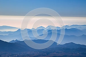 A mesmerizing scene of light blue layeredmountains of Pico de Orizaba volcano in Mexico