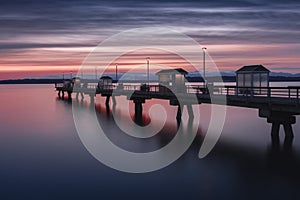 Mesmerizing scene of the sunset on the empty bridge in Edmonds, Washington