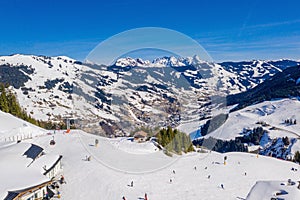 Mesmerizing shot of the snow-covered mountains of Saalbach-Hinterglemm and the ski areas photo