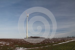 Mesmerizing shot of wind turbines under a cloudy sky