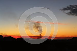 Mesmerizing sunset and chimney smoke