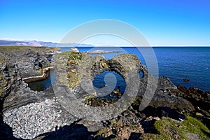 Mesmerizing view of the Gatklettur natural attraction in Arnarstapi, Iceland