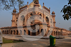 A mesmerizing view of safdarjung tomb memorial and dustbin from the side of lawn at winter morning