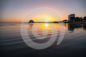 Mesmerizing view of the sea gleaming under the bright sunset - great for wallpapers