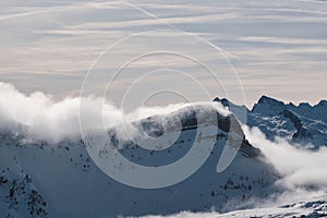 Mesmerizing view of snow-capped mountains in the Alps in winter, Falcade, Dolomites, Italy photo