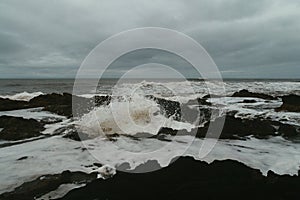 Mesmerizing view of waves crashin to a rocky coast