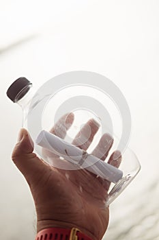Message in the bottle against the sea background