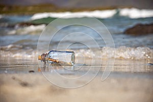 Message in the bottle against the Sun setting down