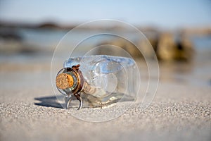 Message in the bottle against the Sun setting down