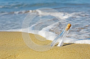 Message in a Bottle on beach sea photo