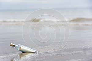 Message In A Bottle Buried In Sand