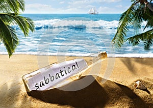 Message in the bottle with the note sabbatical on the beach photo