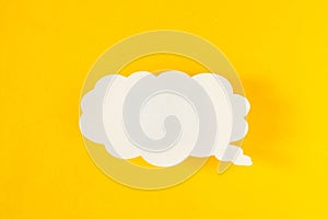 Message in the form of a cloud of paper on a yellow background, social networks, eddy, symbol