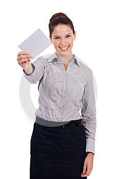 This message is going to get out there. Studio portrait of an attractive young woman holding up a small blank sign