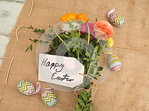 Message happy easter on fabrics with a bouchet of flowers