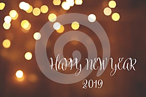 Message HAPPY NEW YEAR 2019 and bokeh effect on background, space for text.