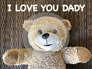 The message that I LOVE YOU DADY by cute teddy bear