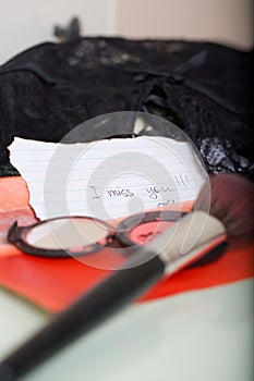 Message left on a woman mirror table- I miss you.