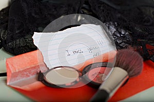 Message left on a woman mirror table- I miss you.