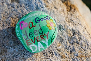 Message painted on a small rock