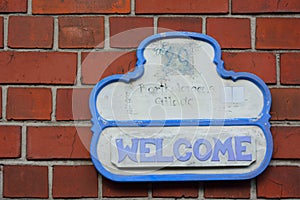 Message on a wall saying Welcome