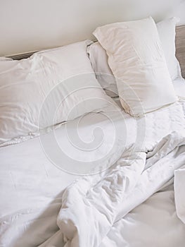Messed up Bed matress and Pillows in bedroom photo