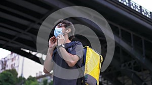 Messenger puts on medical protective mask, side view