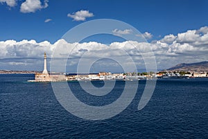 Messina, Sicily, Italy - The gold Madonna della Lettera statue at the entrance to the harbour of Messina