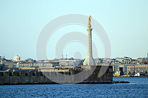 Messina, Sicily Italy: view of the port of Messina entrance with the gold Statue of the Madonna della Lettera