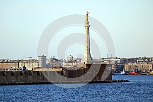 Messina, Sicily Italy: view of the port of Messina entrance with the gold Statue of the Madonna della Lettera