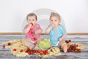 Messy baby toddlers having fun eating