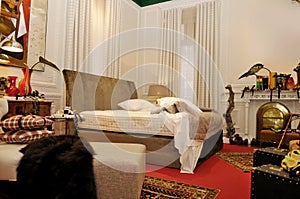 Messy Bedroom with Red Carpet