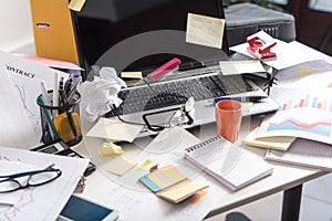 Messy and cluttered desk