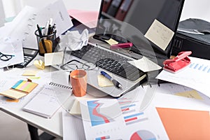 Messy and cluttered desk