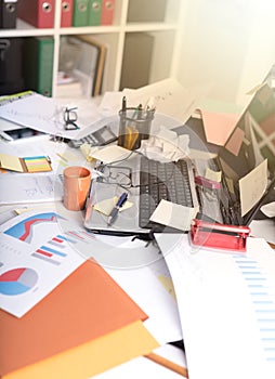 Messy and cluttered desk, light effect