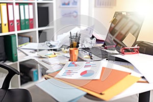 Messy and cluttered desk, light effect