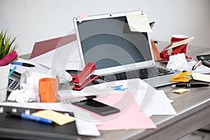 Messy and cluttered desk