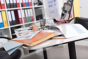 Messy and cluttered desk